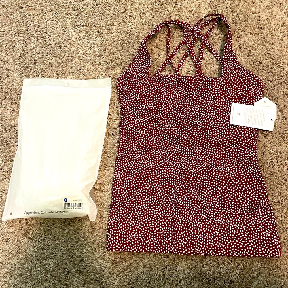 NWT! Buffbunny Revolution Tank Size Small, colors are maroon and white.